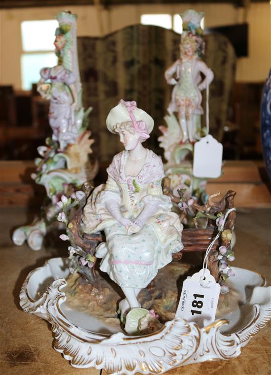 Seated figure of a lady & floral encrusted porcelain candlesticks